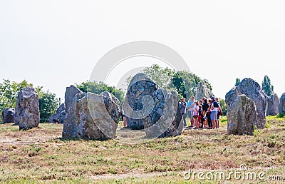 Beautiful view of the standing stones alignments, menhirs, in Carnac, Brittany, France. Megalithic landmark Editorial Stock Photo