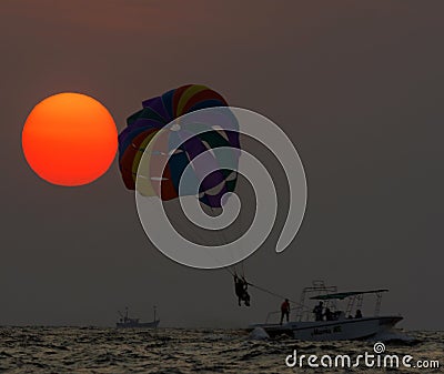 Beautiful view of sunset and parasailing at Colva Beach, Goa Stock Photo
