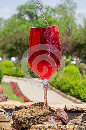 Beautiful view to wine fountain outside the winery on Moldavia in sunny summer day. Stock Photo