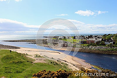A beautiful view of the town of Brora, with homes along the coast on a sunny spring day in Scotland Stock Photo