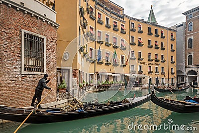 Beautiful view of traditional Gondolas with tourist on famous Canal Grande in Venice, Italy Editorial Stock Photo