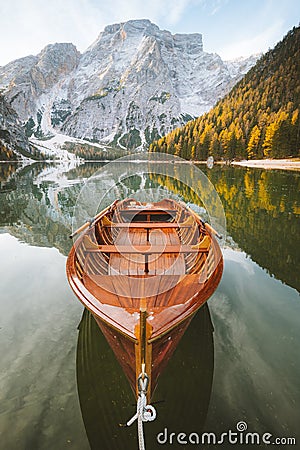 Traditional rowing boat at Lago di Braies at sunrise in fall, South Tyrol, Italy Stock Photo