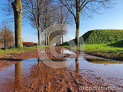 Beautiful view of trees and hills reflecting in a lake in a park, Gorinchem, Netherlands Stock Photo