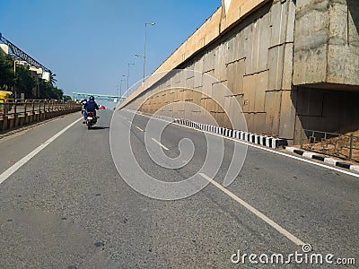 Beautiful view of Tumkur or Nelamangala 8 Lane Road with flyover, metro pillar and metro stop with limited traffic jam on road Editorial Stock Photo