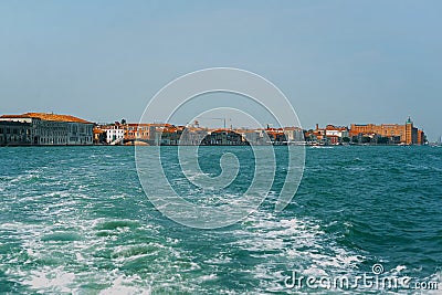 Tugboat sails off the coast of Venice Stock Photo