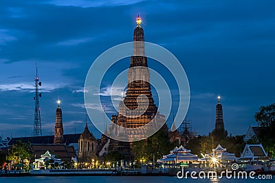 Beautiful view of the Wat Arun temple illuminated by the magical blue hour light after sunset, Bangkok, Thailand Stock Photo