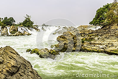 Beautiful view of waterfall landscape. Small waterfall in deep green forest scenery. Stock Photo