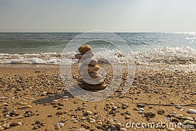 Beautiful view of waves oncoming on composition of stones. Stock Photo