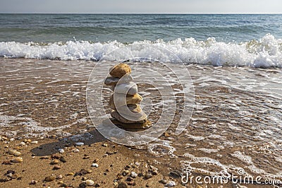 Beautiful view of waves oncoming on composition of stones. Stock Photo