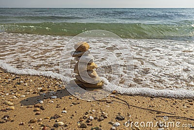 Beautiful view of waves oncoming on composition of stones. Stock Photo