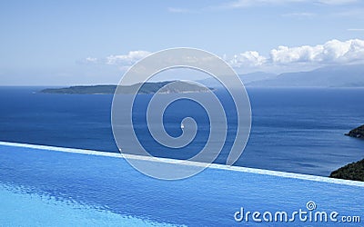 Beautiful views of the infinity pool by the sea Stock Photo