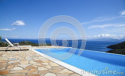 Beautiful views of the infinity pool by the sea Stock Photo