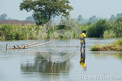 Beautiful views of nature on the banks of a river in West Bengal where some village boys are playing Editorial Stock Photo