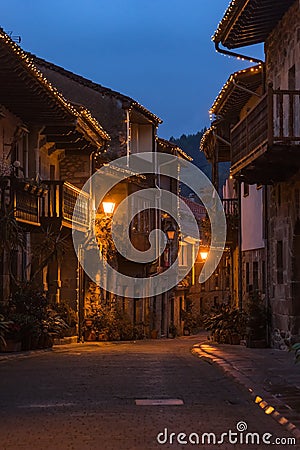 Beautiful village of Cartes illuminated at night, in Cantabria, Spain Stock Photo