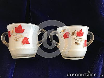 Beautiful Vintage Clear Crystal Glass Sugar Bowl and Creamer with Red and Gold Cold Paint and White Painted Inside Stock Photo
