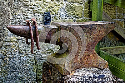Beautiful vintage display with anvil and aged horseshoes Stock Photo