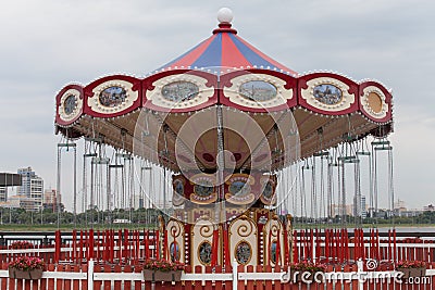 Beautiful vintage merry go round for kids in attraction park Stock Photo