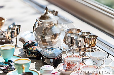 Beautiful vintage set of cups and saucers in porcelain and silver Stock Photo