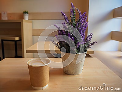 Beautiful violet lavender in a iron little bucket and a cup of coffee on the wooden table Stock Photo