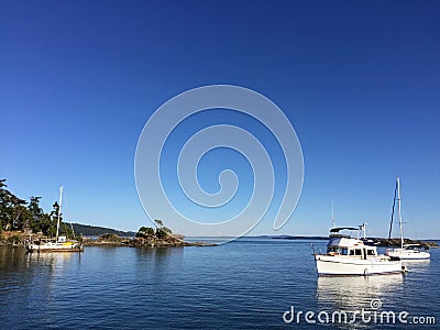 The beautiful vistas of boats anchored off of Portland Island Stock Photo