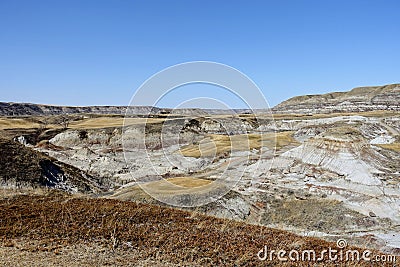 Beautiful vistas of a golf course in the badlands surrounded by canyons, hoodoos, coulees and mountains outside of Drumheller Stock Photo