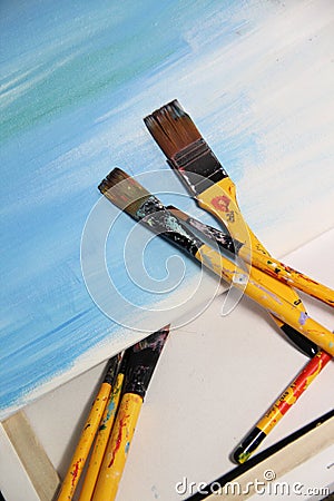 Art palette and paintbrushes Stock Photo