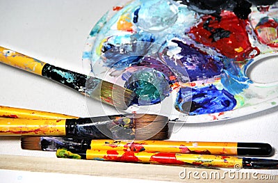 Art palette and paintbrushes Stock Photo