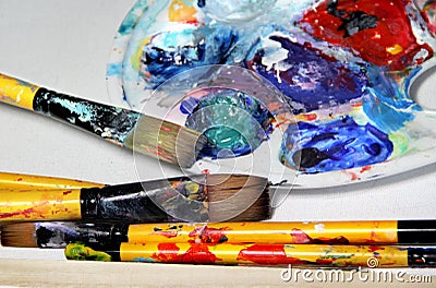 Art palette and paintbrushes Stock Photo