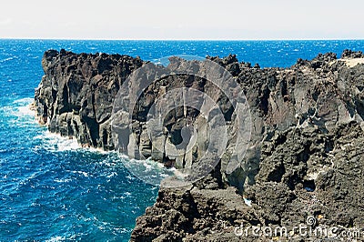 Beautiful volcanic rock shore of the Reunion island. Stock Photo