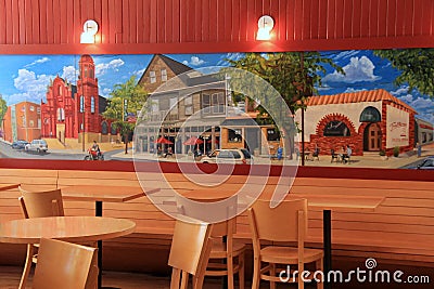 Beautiful wall mural, table and chairs inside bakery,Presti's Bakery,Little Italy,Cleveland,Ohio,2016 Editorial Stock Photo