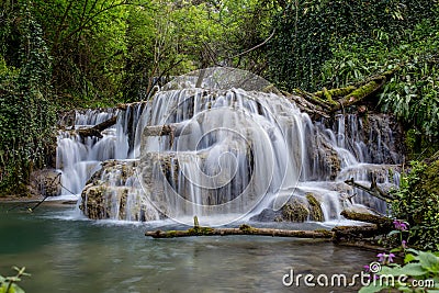 Beautiful waterfall in the middle of the forest Stock Photo