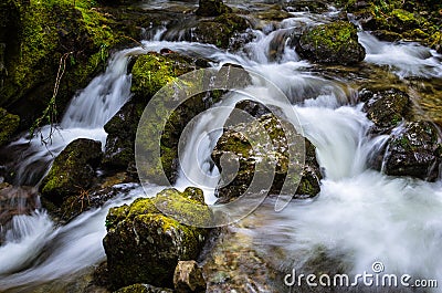 Beautiful Waterfall with Rocks Covered with Moss Stock Photo