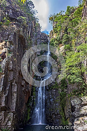 Beautiful waterfall of Veu da Noiva between the covered stones of moss and the vegetation Stock Photo