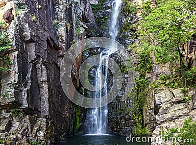 Beautiful waterfall of Veu da Noiva between the covered stones of moss and the vegetation Stock Photo