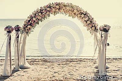 Beautiful wedding arch on the beach Stock Photo