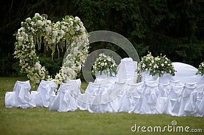 Beautiful wedding arch decorated with white and green flow Stock Photo