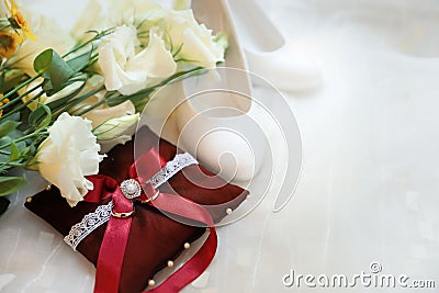 Beautiful wedding bouquet, shoes and decorative pillow Stock Photo