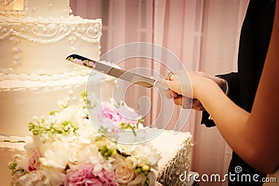 Beautiful wedding cake about to be cut Stock Photo