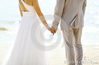 Beautiful wedding couple, bride and groom together near sea Stock Photo