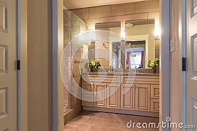 Beautiful white bathroom with a transparent shower and a large mirror Editorial Stock Photo
