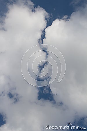 Beautiful white clouds separated from each other over blue sky Stock Photo