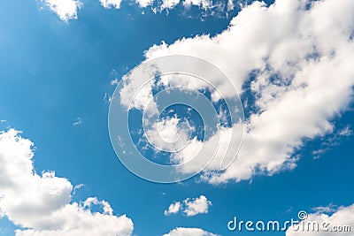 Beautiful white fluffy clouds slowly float against the blue sky on a warm sunny summer day. Timelapse video of cloud movement high Stock Photo