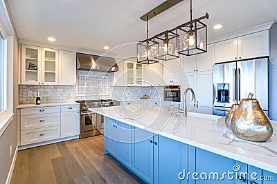 Beautiful white kitchen with large island. Stock Photo