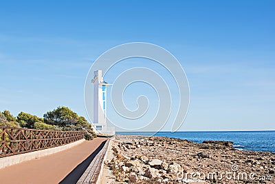 Beautiful white modern lighthouse on the seafront Stock Photo