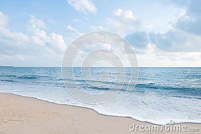 Beautiful white sand beach and ocean waves with clear blue sky Stock Photo