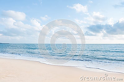 Beautiful white sand beach and ocean waves with clear blue sky Stock Photo