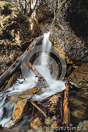 Beautiful white waterfalls in a rocky environment known as Janosikove diery, Lesser Fatra, Slovakia. stream of water finds its way Stock Photo