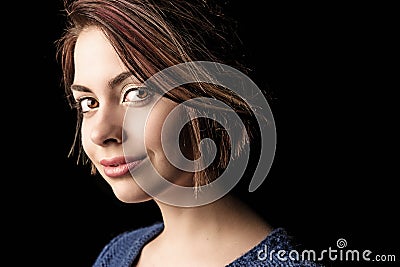 Beautiful wide eyed woman with captivating gaze Stock Photo