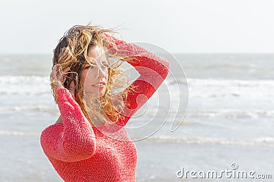 Beautiful wind hair girl on the beach Stock Photo