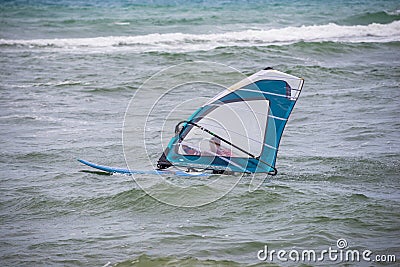 windsurfer with a board on a tropical beach, makes water start Editorial Stock Photo